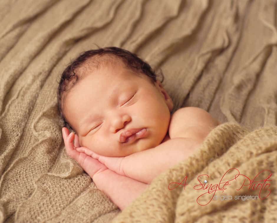 baby girl wrapped newborn