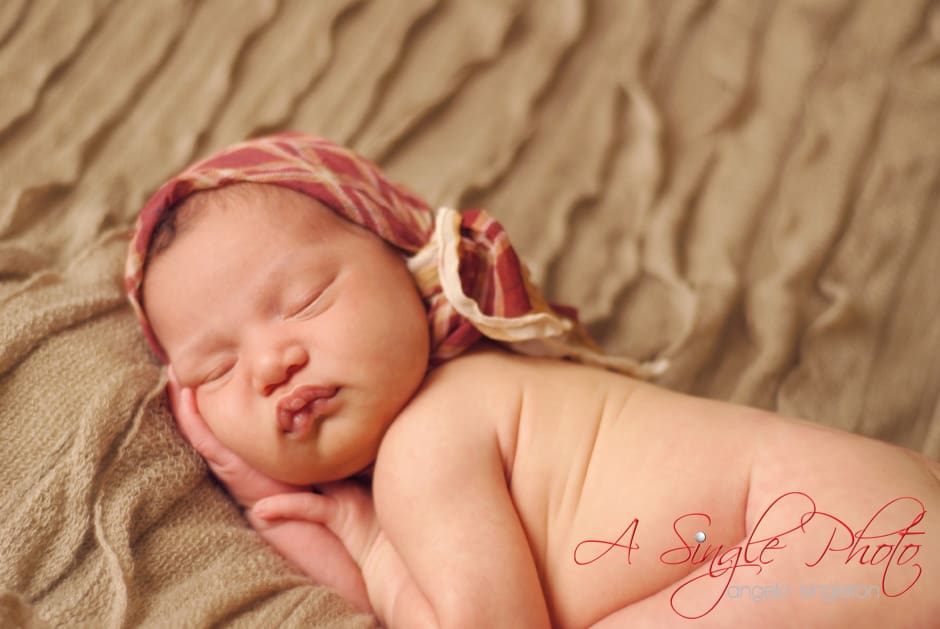 baby wrapped newborn session