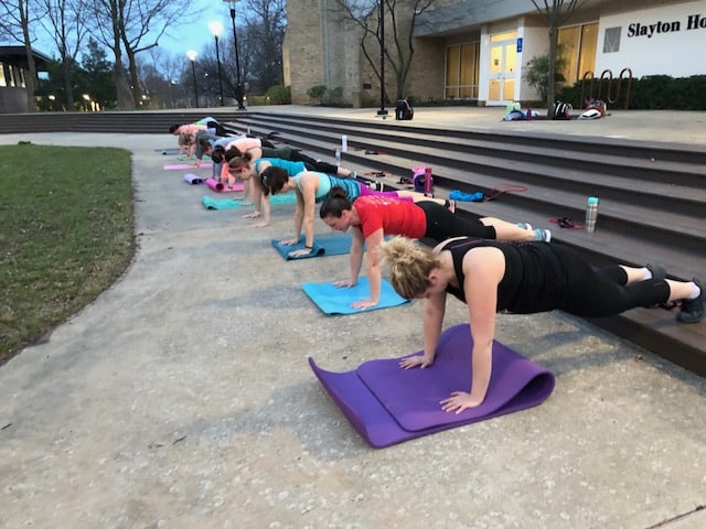 Women on yoga mats doing pushups Fit4Mom Howard County