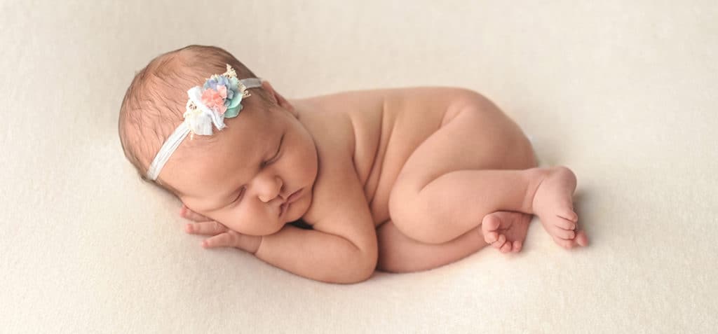 snuggle posed newborn baby girl 