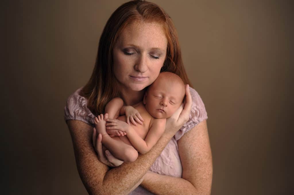 newborn image of a mom holding her baby taken by Maryland Newborn Photographer
