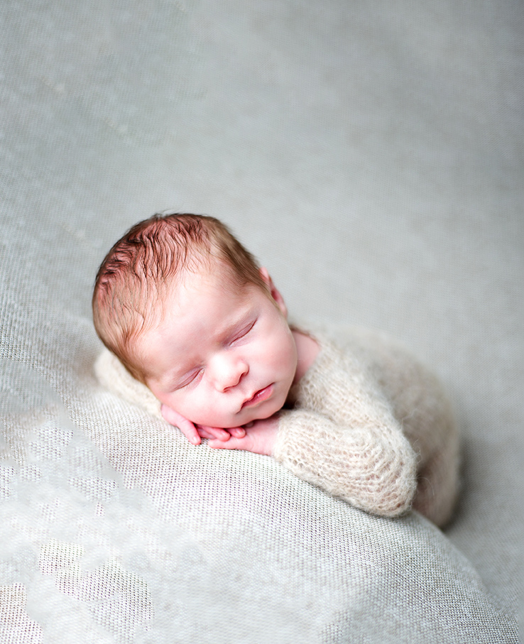 newborn photography in maryland of a liitle sleeping baby on a neutral backdrop 